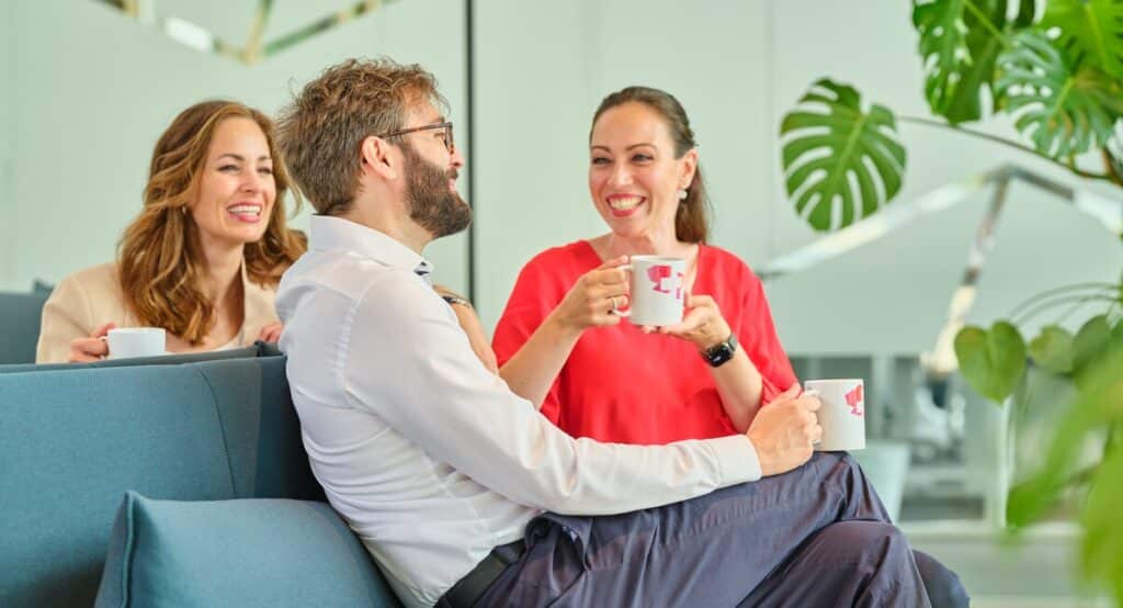 Startup ecosystem young people talking, dringing coffe at the innovation lounge