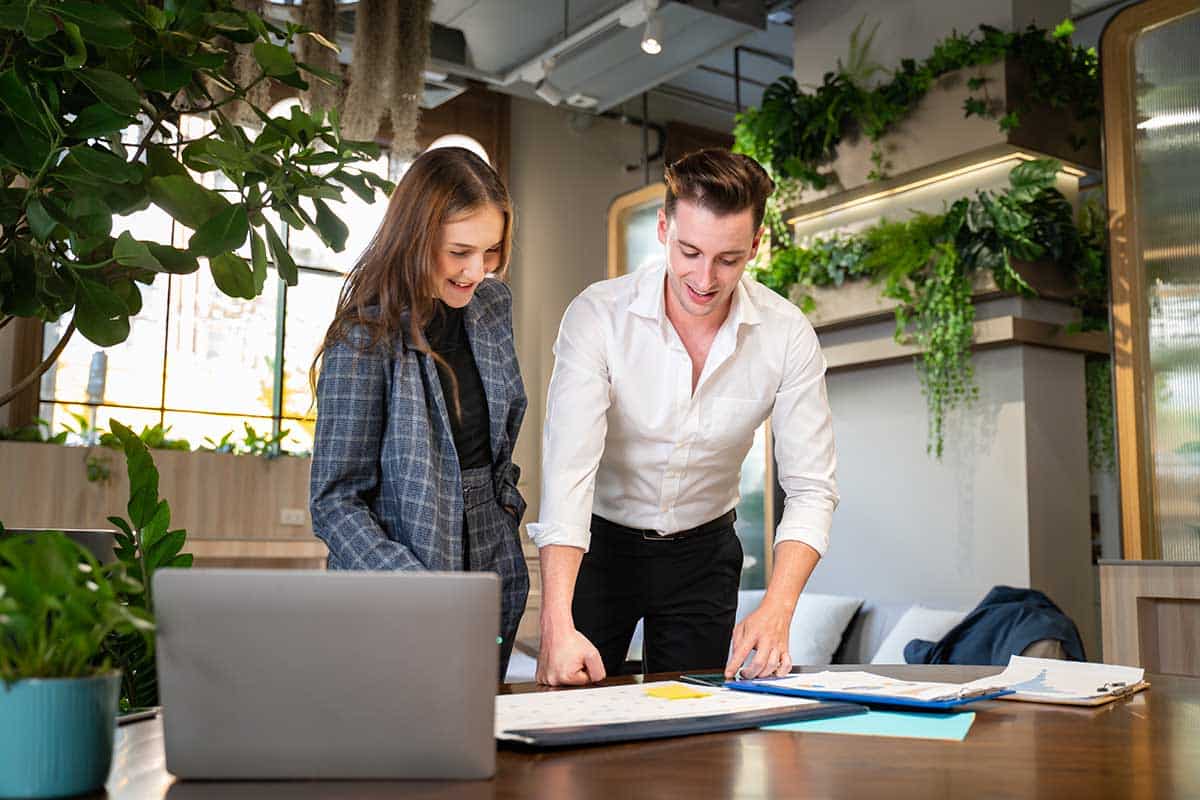 concept of Multi-Ethnic Office Conference Room Meeting.Multicultural Team of Creative Entrepreneurs Talking,Discuss Growth Strategy,planning.Diverse Young Business People work on e-Commerce Startup.